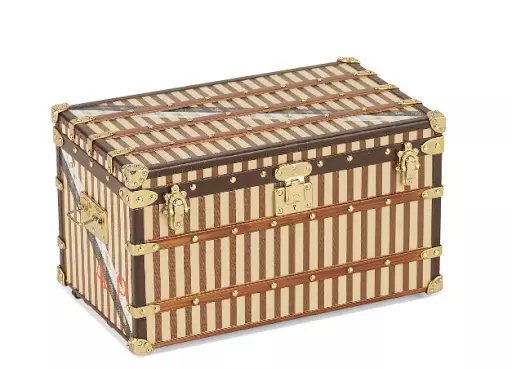 A Courrier 1888 trunk paperweight, Louis Vuitton, 2000. Image courtesy of Bonhams.