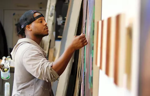 Titus Kaphar in his studio. Image courtesy of the John D. and Catherine T. MacArthur Foundation.