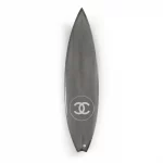 Chanel x Philippe Barland silver carbon fiber, polyuerathane, and fiberglass surfboard.