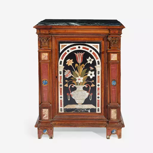 An Italian Renaissance-style carved walnut cabinet with pietra dura panels. Image courtesy of Freeman’s.