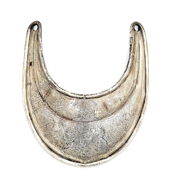 Extremely rare silver gorget (throat cover) from British 5th Regiment, which fought at the Battles of Lexington and Concord. One of few known surviving examples created in the rare double-lobe pattern. Book example. Ex Tom Grinslade collection. Estimate $10,000-$30,000