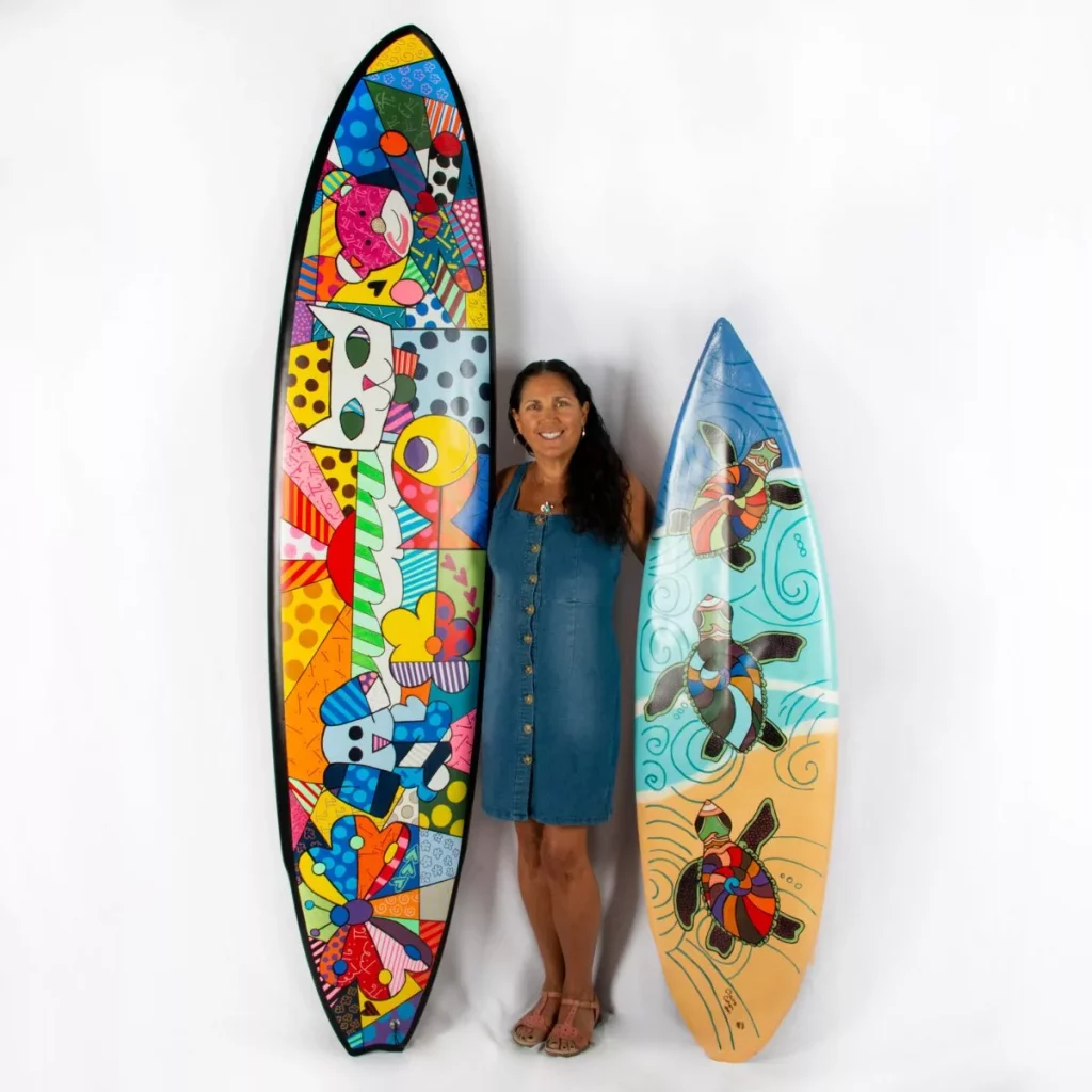 CLAIRE P. COHEN (AMERICAN B. 1958) FRIENDSHIP LOVING SUNRISE ORIGINAL MIXED MEDIA ON RECYCLED SURFBOARD. DIMENSIONS 8’4” X 22.25” EXECUTED IN 2022 ESTIMATE $700-$1200
