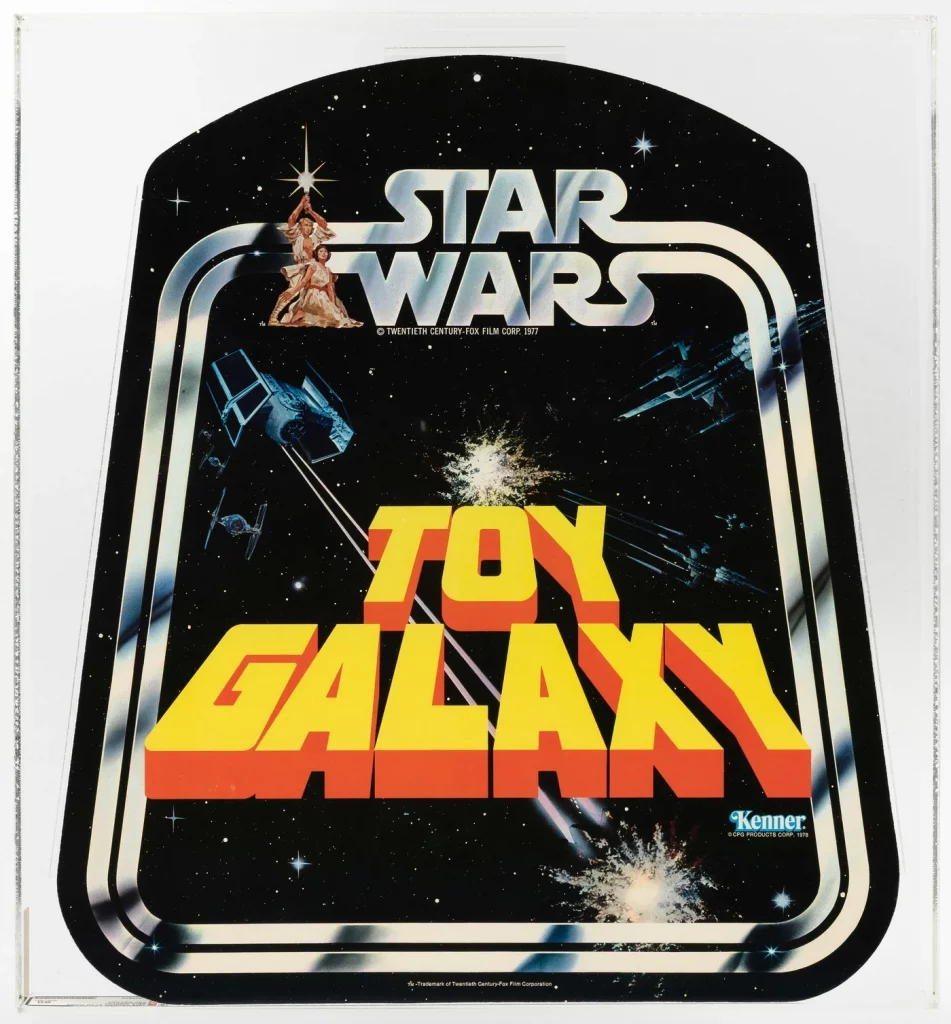 Top: 1979 Toy Center store display in encapsulated case, AFA-graded 60 EX, Star Wars Action Figures text plus graphics that include Darth Vader, TIE Fighters, X-Wing Fighters; 24 x 40in long. Estimate $5,000-$10,000. Bottom: 1978 Toy Galaxy double-sided bell-shape hanger, AFA-graded 90 NM+/Mint, 16 x 18in long, graphics include Luke Skywalker and Princess Leia as seen on the Star Wars movie poster by The Brothers Hildebrandt, plus Darth Vader’s TIE Fighters battling X-Wing Fighters. Estimate: $5,000-$10,000