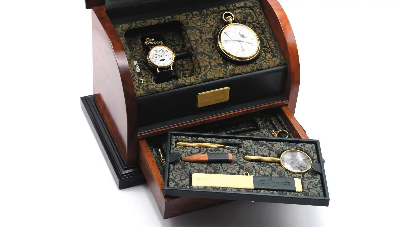 Breguet, Breguet subscription box, c. 1991, no. 44, hazelnut root, upholstered with a leafy pattern and covered with green leather, containing a yellow gold astronomical perpetual pocket watch (diam. 6.2 cm/2.44 in) and a yellow gold perpetual calendar wristwatch with a minute repeater (diam. 3.7 cm/1.45 in). Estimate: €180,000/250,000