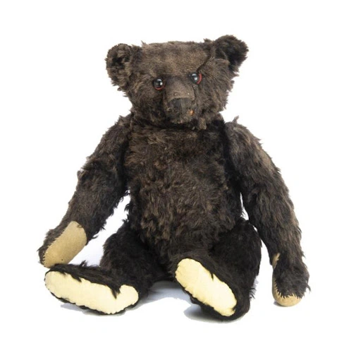Lot #40: A Steiff black mohair teddy bear, c. 1912. Image courtesy of Special Auction Services.
