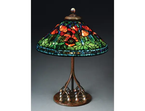 Tiffany Studios table lamp with 20in conical leaded-glass shade in ‘Poppy’ motif exhibiting the very highest standards of Tiffany artistry. Astounding colorway and complex composition. Exceptionally rare base with 16 iridescent Favrile-glass balls as supports for the telescoping stem. Tiffany stamps to both shade and base. Sold for $541,200 (inclusive of 23% buyer’s premium), a world auction record for Tiffany’s Poppy pattern, against an estimate of $350,000-$450,000. Morphy Auctions image 