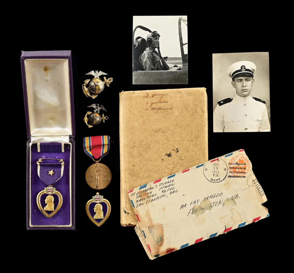 Archive of World War II hero pilot USMC Captain Grafton S. Stidger of ‘The Fighting Corsairs.’ Includes Purple Heart Medal with ribbon bar, WWII Victory Medal, photos, signed letter from US Navy Admiral W.F. Halsey and other ephemera, plus Stidger’s logbook with closing notation that he was killed in action on January 14, 1944. One of six servicemen’s Purple Hearts entered in the auction. Estimate $3,000-$5,000
