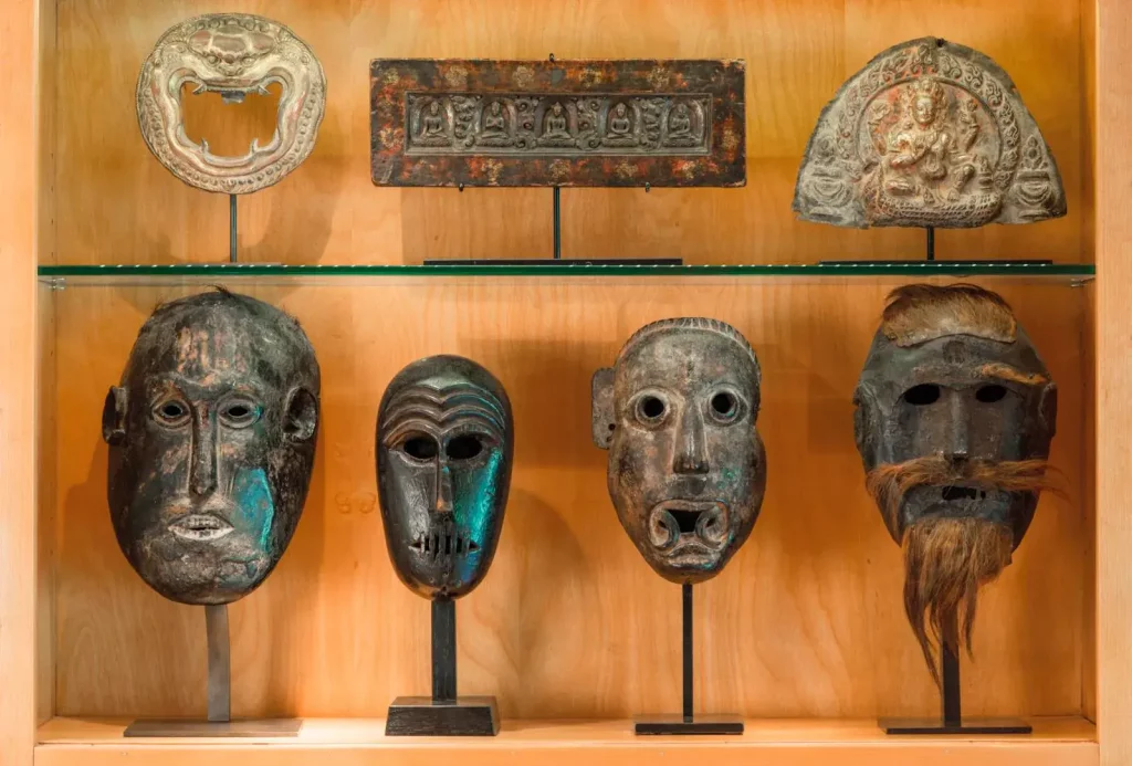 Tibetan works and Nepalese masks—all acquired at Parcours des mondes —from the Singers’ Himalayan art collection.