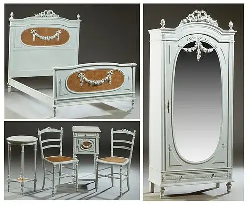 French Louis XVI Style Polychromed Beech Bedroom Suite, early 20th c., consisting of a cane inset double bed; a single mirror door armoire; a pair of cane seat side chairs; a caned door marble top night stand and a circular marble top lamp table, with a caned lower shelf, Bed- H.- 60 in., Int. W.- 74 in., Int. D.- 52 in. (6 Pcs.)