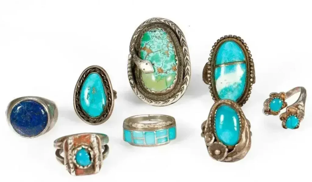 Navajo Turquoise Rings. Old Pawn Southwest jewelry, consisting of a miscellaneous grouping of 8 silver and turquoise rings. Approximate size: 1 3/4 inches in length largest example. Rings sizes range from approximately: 5, 7, 8 1/2 and 10. Approximate total weight: 88 g. Estimate $200-$300.