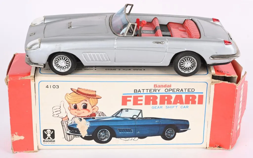 Bandai tin battery-operated Ferrari gear-shift car, 10½in long, all original and in working order with original pictorial box. Excellent condition. Estimate $200-$400