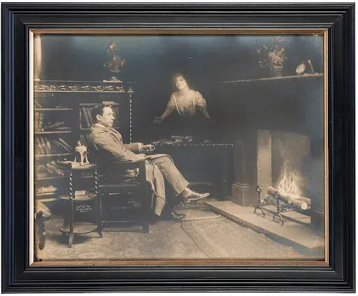 A 1910 spirit photograph of a materializing ghost. Image courtesy of Potter & Potter Auctions. 