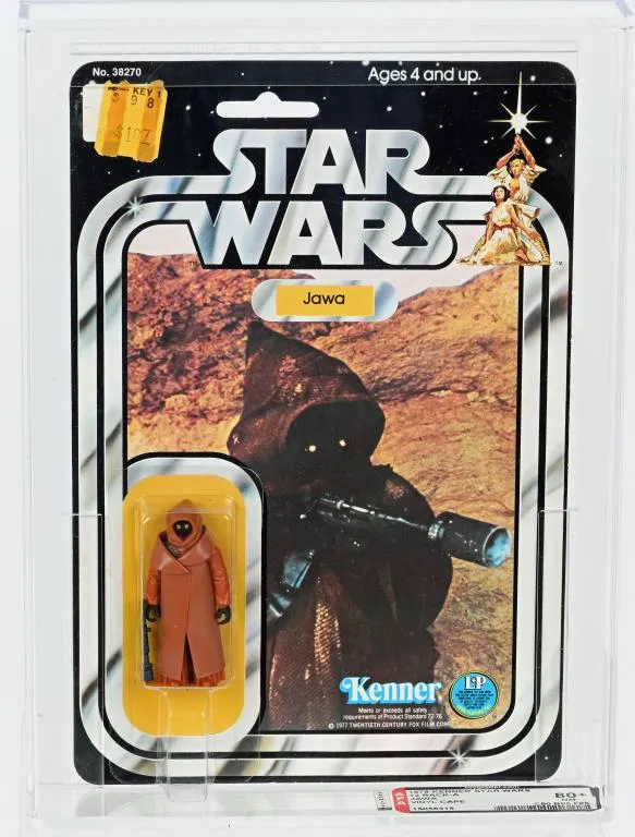 1978 Kenner Star Wars Jawa vinyl-cape action figure, beautiful condition, on crisp 12 Back-A card with clear bubble. AFA graded 80+ Near Mint. Among the most desirable of Kenner Star Wars figures. Estimate $40,000-$50,000