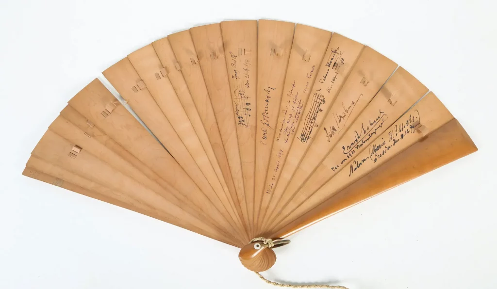 Viennese sandalwood fan, circa 19th century, signed by Brahms and his circle of colleagues (Estimate: $3,000-5,000)