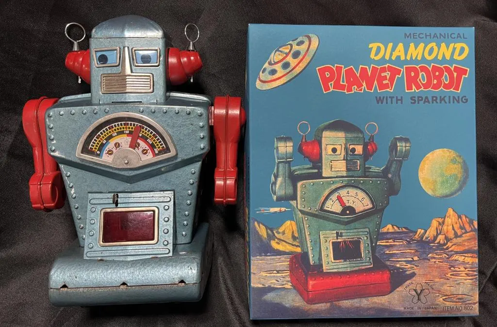 Original Yonezawa (Japan) 10in tin windup Diamond Planet Robot, rare variation with blue body and red arms, 100% original, with high-quality repro box. Sold within estimate for $33,210
