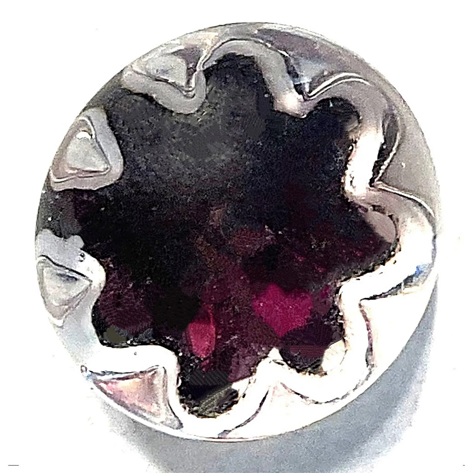 Lot #534, a purple radiant outline glory glass button, was estimated at $200 to $400 and sold for $1,750. Image courtesy of Lion and Unicorn.
