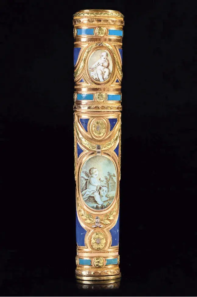 Paris, 1768-1774. Oval cross-section gold wax case with polychrome enameled decoration, with a background, imitating lapis lazuli, enameled in blue and sprinkled with gold, two medallions of putti painted on enamel in grisaille on each side, 11.8 x 2.1 x 1.9 cm/4.3 x 0.8 x 0.4 in., gross weight 58 g/2 oz. Hôtel Drouot, October 27, 2023. Coutau-Bégarie auction house. Cabinet Sancy Expertise Paris. Sold for €7,900