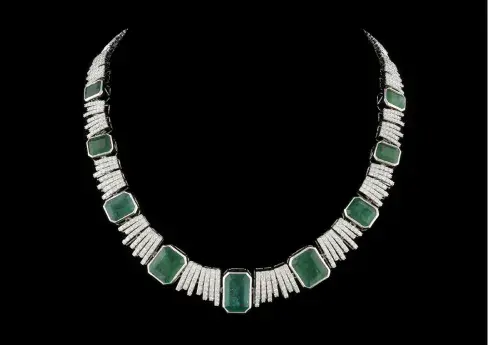 18K white gold, emerald and diamond necklace. Nine graduated emerald-cut emeralds with total weight of 49.20cts (largest stone measuring 15.4mm x 7.0mm), and 640 brilliant-cut diamonds with total weight of 8.91cts. Overall clasped length 17.5in. Gross weight: 57.5g. Marked ‘Oscar Friedman 18K EM29.51ct D5.68ct’ under clasp. Accompanied by original GemAssure Gemological Appraisals Report. Estimate: $20,000-$40,000
