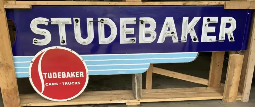 All-original Studebaker Art Deco bull-nose porcelain neon sign, double sided, sharp colors, fantastic condition. Size: 10ft 6in long x 47in tall at round and 2ft at other end; 12in thick. Made by Walker & Co. From an advanced private collection. Sold for $21,000 against an estimate of $15,000-$25,000