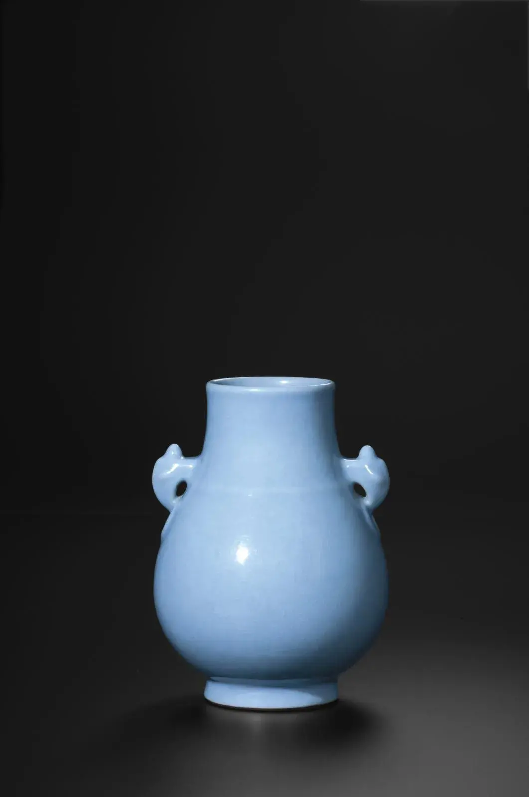 Vase with two handles with monster faces, porcelain, lavender-blue glaze, Jingdezhen kilns, Qing dynasty, Qianlong (1736-1795), h. 16.8 cm/6.3 in, diam. opening 6.7 cm/2.4 in, Zhuyuetang Collection.
Richard W.C. Kan's Zhuyuetang collection/photo: Barry Lui