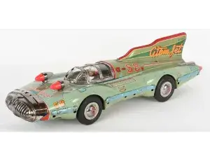 Large and wildly futuristic Yonezawa (Japan) tin friction #58 Atom Jet racer with driver inside clockwork. Beautiful colors, graphics and details. Both friction and motor sound are functional. Length: 26in. Sold for $25,740 against an estimate of $10,000-$15,000