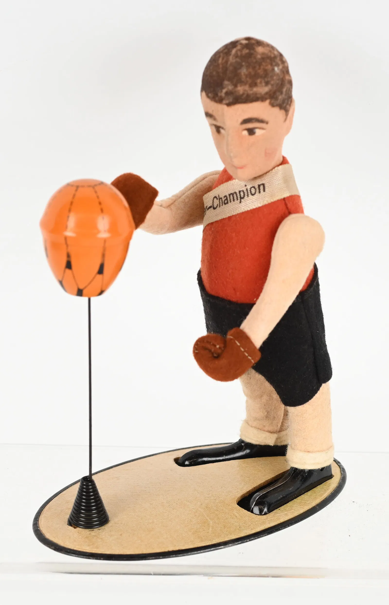 Schuco felt and tin windup Boxer Jack with platform and punching bag. Figure has painted facial features and wears original Schuco Germany imprinted fabric sash that says ‘Boxer-Champion.’ Height 6in. All-original and in working order. Beautiful condition. Estimate $2,000-$2,500
