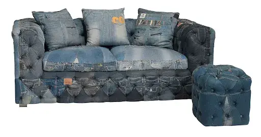 Amen Wardy custom-made blue jeans upholstered sofa and ottoman. Image courtesy of Brunk Auctions. 
