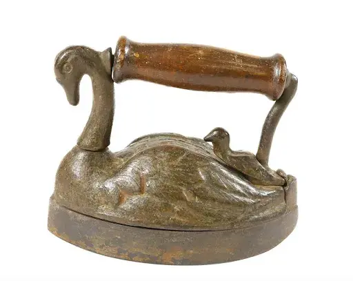 Lot #200, a Barnes Patent Swan on Swan box iron, is estimated at $4,000 to $8,000. Image courtesy of Hartzell’s Auction Gallery.