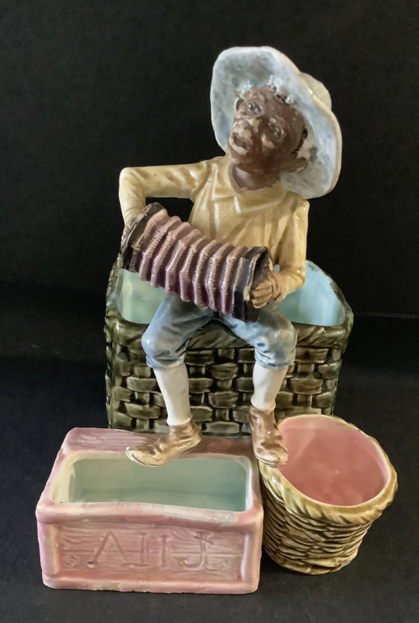 Majolica Boy playing music figurine