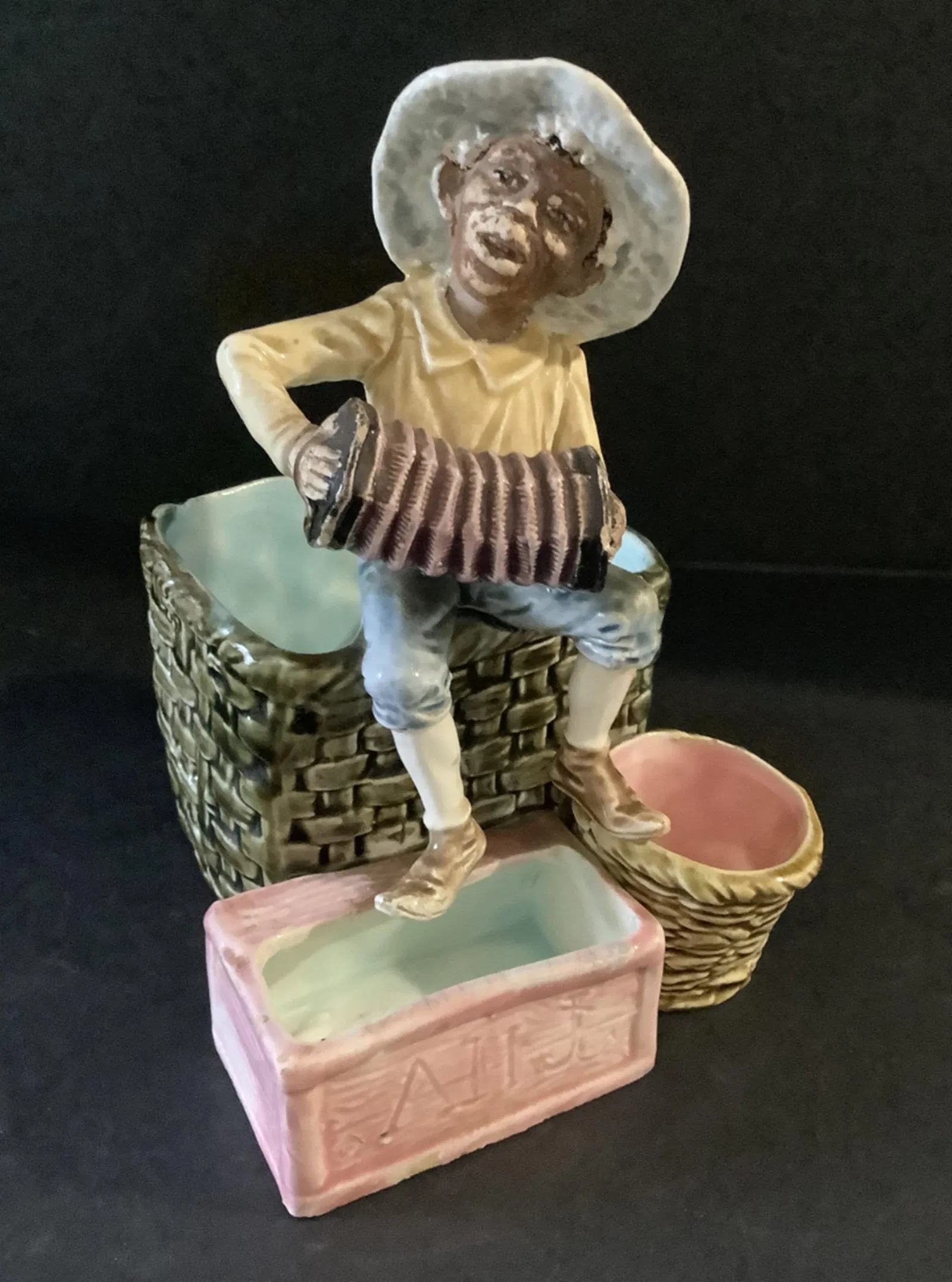 Majolica Boy playing music figurine