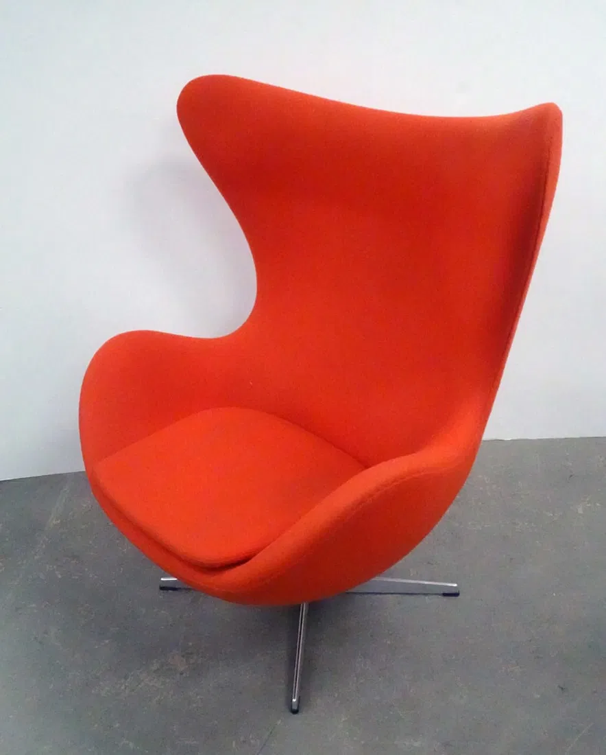 One of an identical pair of labeled Arne Jacobsen for Fritz Hansen Inc Egg Chairs, which will be sold individually and consecutively as Lots 229 and 230, each with an estimate of $1,500-$2,500
