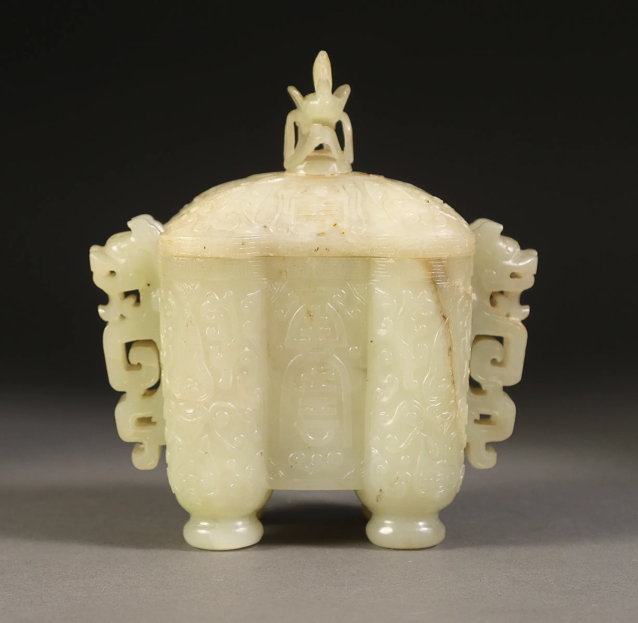 A Chinese Carved Pale celadon Jade Archaistic Covered Vessel, Tulu, Qing Dynasty (Estimate $4,000-6,000)
