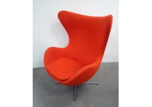 One of an identical pair of labeled Arne Jacobsen for Fritz Hansen Inc Egg Chairs, which will be sold individually and consecutively as Lots 229 and 230, each with an estimate of $1,500-$2,500