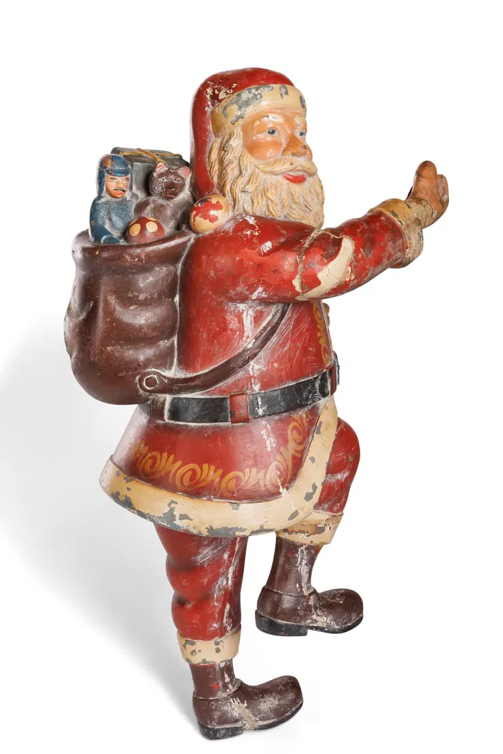 An early 20th-century carved wooden Santa Claus was estimated at $300 to $500 and sold for $2,880. Image courtesy of Bray and Company Auctions.
