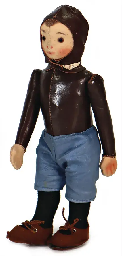 Lot #161, a doll dressed as a pilot or race car driver, has an opening bid of EUR 560. Image courtesy of Ladenburger Spielzeugauktion. 
