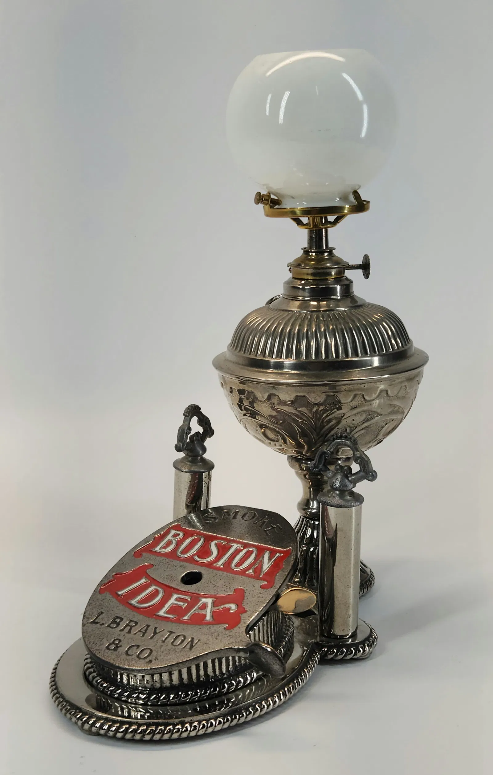 Lot #130, a Boston Idea cigar cutter table lamp, was estimated at $200 to $400 and sold for $923. Image courtesy of Gehman Auctions.
